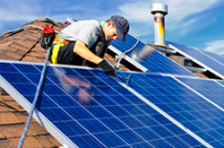 Electrician working on a solar panel roof in Selby